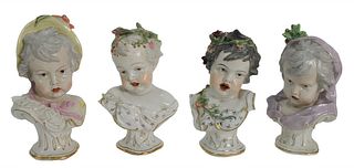 Set of Four Porcelain Baby Busts having matching bases, tallest 9 inches.