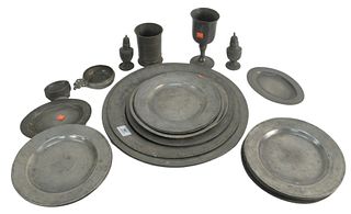 Twenty-Five Piece Pewter Lot to include chargers, plates, pepper shakers, and mug, largest diameter 16 1/2 inches. Provenance: From a Newport, Rhode I