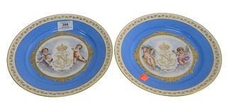 Pair of Dore A Sevres Porcelain Plates having painted putti and "N" with crown, height 9 3/8 inches.