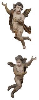 Pair of Italian/German Painted Cherubs, carved wood, gesso, and polychromed, probably 18th century, heights 33 and 36 inches.