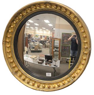 Regency Giltwood and Ebonized Convex Mirror, diameter of mirror 21 1/2 inches, total diameter 26 1/2 inches.
