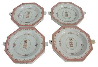 Four Piece Group of Chinese Export Armorial Octagonal Warming Dishes, Qing Dynasty, Qianlong period, each painted with the arms of Ludlow and flanked 