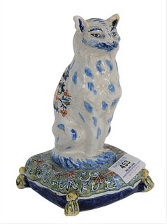 A Polychrome Dutch Delft Cat, seated position on a pillow, height 7 1/2 inches. Provenance: John Walton receipt from 1977. The Estate of Diana Atwood 