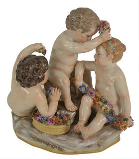 Meissen Figural Group having three puttis with flowers, (minor losses), height 5 inches, width 5 inches.