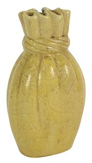 Chinese Porcelain Monochrome Vase in shape of tied off satchel with even yellow glass, 19th century, six character Qianlong seal (but probably later),