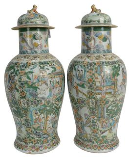Pair of Chinese Porcelain Jars having painted panels of courtyard scenes with figures, height 17 inches.