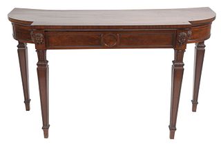 Regency Mahogany Pier Table having carved masks with grape headdress with one drawer and tapered legs, height 35 1/2 inches, width 62 inches.