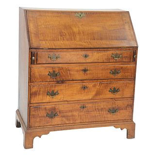 Chippendale Tiger Maple Desk, having slant front over four drawers on bracket base, interior with drawers and pigeon holes, circa 1760, height 41 1/2 