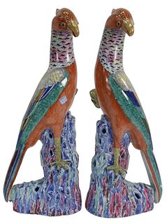 Pair of Contemporary Chinese Style Porcelain Birds with multicolor glaze, heights 21 1/2 inches (as is with a few chips).