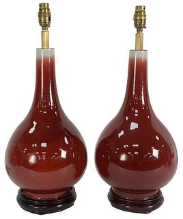 Pair of Oxblood Vases on black wood bases drilled into table lamps, height 20 inches. Provenance: Collection from Mr. and Mrs. Fowler, West Hartford, 