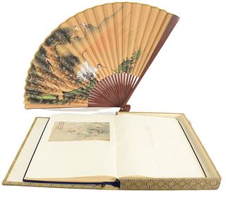 Two piece Oriental group to include a book with printed scrolls, height 22 inches, width 15 inches; along with a large fan.