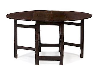 * A William and Mary Oak Drop Leaf Table Height 29 1/4 x width 22 x depth 41 1/2 inches closed.