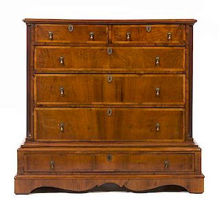 * A George I Style Walnut Chest of Drawers Height 44 1/2 x width 48 x depth 23 1/4 inches.