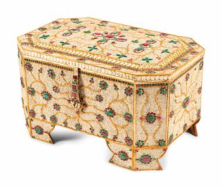 A Mughal Style Ruby, Emerald, Silvered and Gilt Filigree Table Casket
Height 13 x width 22 1/2 x depth 14 1/2 inches.