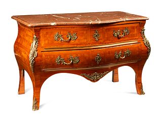 A Regence Style Gilt Bronze Mounted Parquetry Marble-Top Commode
Height 33 x width 51 1/2 x depth 25 1/2 inches.