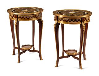 A Pair of Louis XV Style Gilt Bronze Mounted Pietra Dura-Top Tables
Height 30 x diameter 22 1/2 inches.