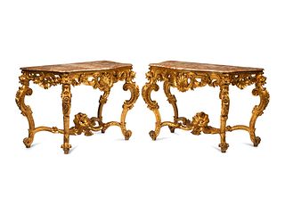 A Pair of Louis XV Style Giltwood Console Tables
Height 39 x width 63 1/2 x depth 28 inches.