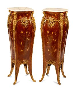 A Pair of Louis XV Style Gilt Bronze Mounted Marquetry Marble-Top Pedestals
Height 47 x width 16 x depth 16 inches.
