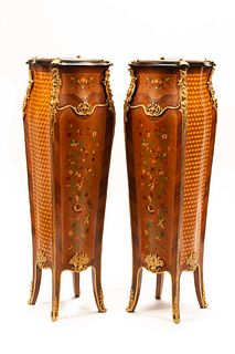 A Pair of Louis XV Style Gilt Metal Mounted Marquetry Marble-Top Pedestals
Height 51 x width 14 x depth 14 inches.