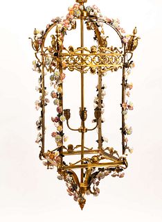A Louis XV Style Gilt Bronze and Porcelain Hall Lantern
Height 47 x width 19 x depth 19 inches.