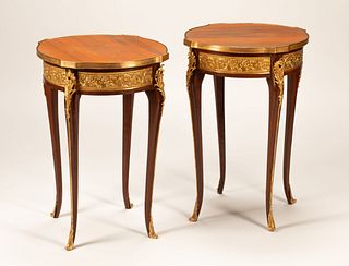 A Pair of Louis XV Style Gilt Bronze Mounted Marble-Top Gueridons
Height 28 1/2 x diameter of tops 19 1/2 inches.