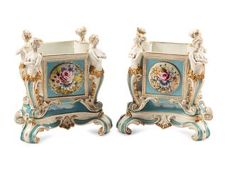 A Pair of Sevres Style Porcelain Cache Pots
Height 12 1/2 x width 12 x depth 9 1/2 inches.