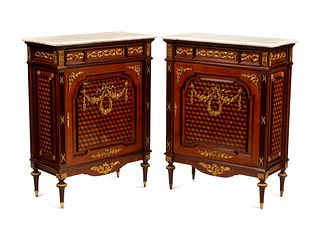 A Pair of Louis XVI Style Gilt Bronze Mounted Parquetry Marble-Top Cabinets
Height 44 x width 33 1/2 x depth 16 inches.
