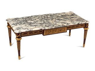 A Louis XVI Style Gilt Bronze Mounted Marble-Top Cocktail Table
Height 20 x width 52 x depth 25 1/2 inches.