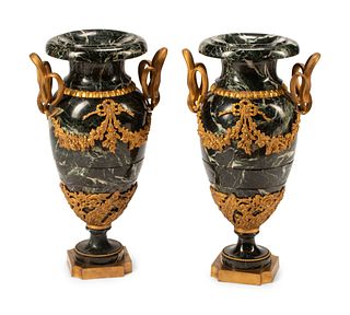 A Pair of French Gilt Bronze and Marble Urns
Height 24 inches.