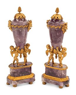A Pair of French Gilt Bronze and Amethyst Figural Urns
Height 19 inches.