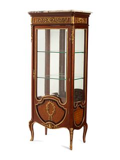 A Louis XVI Style Marble-Top Vitrine Cabinet
Height 64 x width 47 x depth 18 1/2 inches.