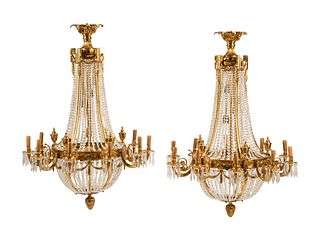 A Pair of French Neoclassical Style Gilt Bronze Chandeliers
Height 46 x diameter 33 1/2 inches.