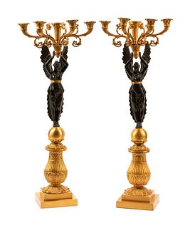 A Pair of Empire Style Gilt and Patinated Bronze Five-Light Candelabra
Height 31  x width of arms 13 inches.