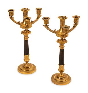 A Pair of Empire Style Gilt and Patinated Bronze Four-Light Candelabra
Height overall 16 1/2 inches.