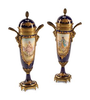 A Pair of Gilt Bronze Mounted Sevres Style Porcelain Urns
Height 17 inches.