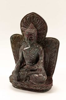 A Carved Ruby-Zoisite Figure of a Seated Deity
Height 14 x width 10 x depth 5 inches.
