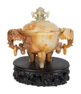A Chinese Carved Hardstone Tripod Censer
Height overall 7 1/2 inches.