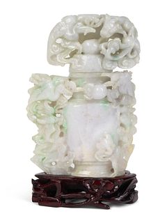 A Chinese Carved Jadeite Urn with Flowers
Height overall 6 inches.