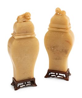 A Pair of Chinese Carved White Stone Jars on Wood Bases
Height 12 inches.