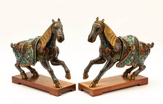 A Pair of Chinese Cloisonne Horses with Wood Stands
Height 16 1/2 x length 19 x width 6 inches.