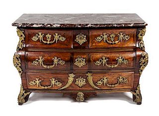A Regence Walnut Commode en Tombeau Height 33 1/2 x 51 1/2 x 25 3/4 inches.