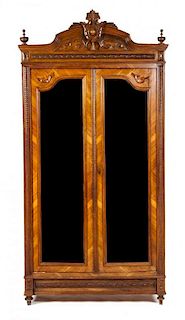 A French Renaissance Revival Walnut Armoire Height 94 x width 46 1/2 x depth 16 3/4 inches.