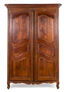 A Louis XV Provincial Armoire Height 91 x width 65 x depth 26 inches.