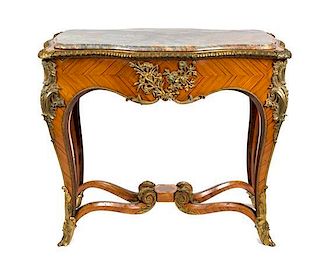 * A Louis XV Style Gilt Bronze Mounted Center Table Height 35 x width 41 1/2 x depth 24 inches.