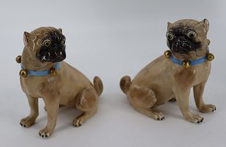 A Pair Of Dresden Porcelain Pug Dogs.