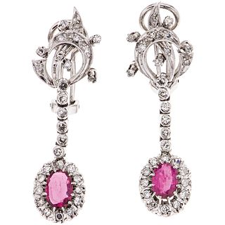 PAIR OF EARRINGS WITH RUBIES AND DIAMONDS IN PALLADIUM SILVER with 2 Oval cut rubies ~1.40 ct and 58 8x8 cut diamonds ~0.80 ct. Weight: 9.1 g