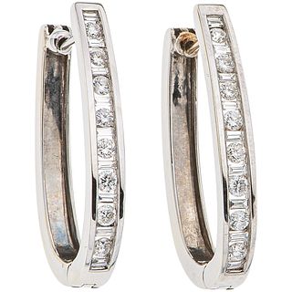 PAIR OF EARRINGS WITH DIAMONDS IN 14K WHITE GOLD with 16 brilliant cut diamonds ~0.60 ct and 18 baguette cut diamonds ~0.25 ct