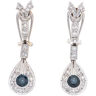 PAIR OF EARRINGS WITH SAPPHIRES AND DIAMONDS IN PALLADIUM SILVER with 2 round cut sapphires ~0.80 ct and 34 8x8 cut diamonds ~0.48 ct