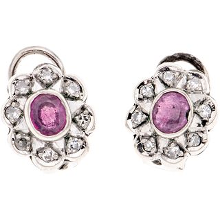 PAIR OF EARRINGS WITH RUBIES AND DIAMONDS IN PALLADIUM SILVER with 2 oval cut rubies ~0.50 ct and 16 8x8 cut diamonds ~0.30 ct