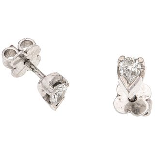 PAIR OF STUD EARRINGS WITH DIAMONDS IN PALLADIUM SILVER AND SILVER with 2 pear cut diamonds ~0.44 ct Clarity: I1-I2 Color: J-K